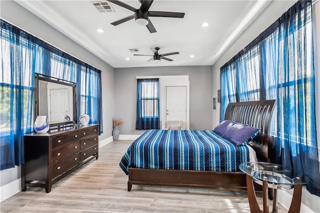 bedroom featuring light wood-type flooring and ceiling fan