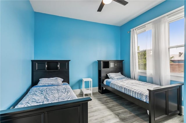 bedroom featuring hardwood / wood-style floors and ceiling fan