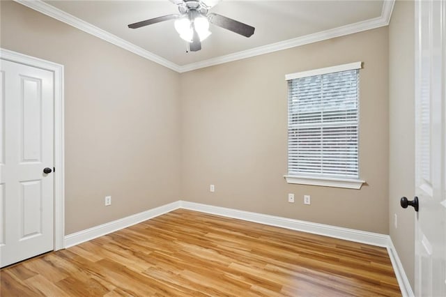 empty room with wood-type flooring, ceiling fan, and crown molding