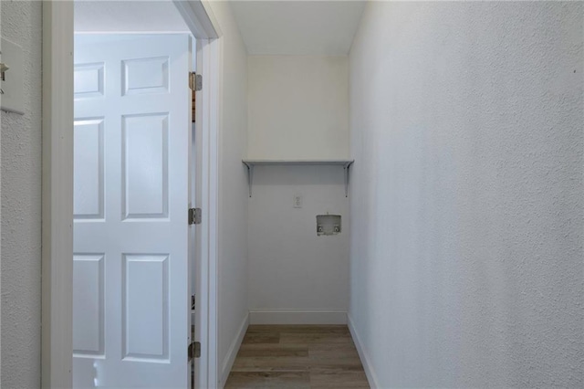 washroom featuring hardwood / wood-style floors and hookup for a washing machine