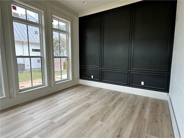 empty room with light hardwood / wood-style floors