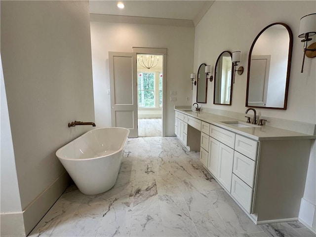 bathroom with vanity and a bath