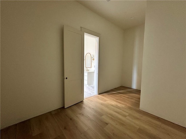 unfurnished room with light hardwood / wood-style floors