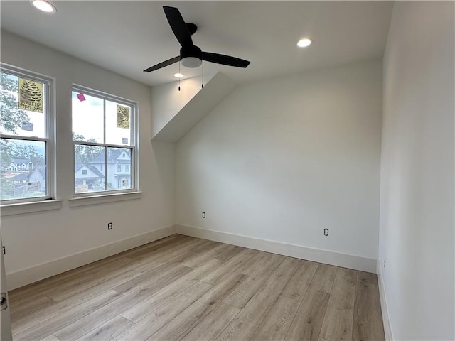 additional living space with ceiling fan and light hardwood / wood-style floors