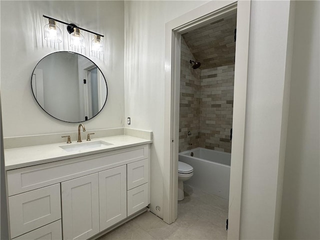 full bathroom featuring tiled shower / bath combo, vanity, and toilet