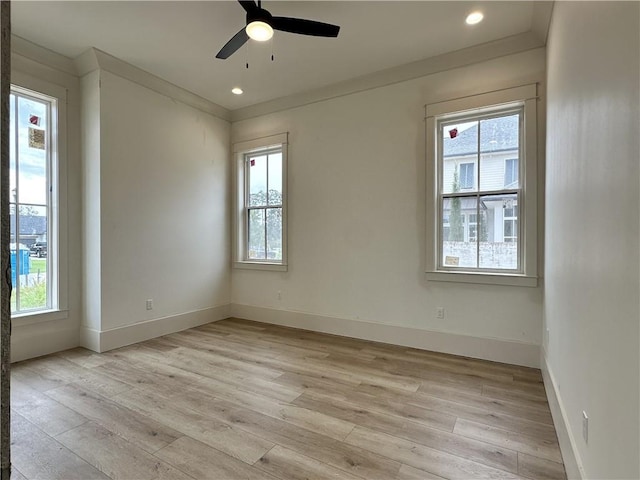 unfurnished room with ornamental molding, light hardwood / wood-style flooring, and ceiling fan