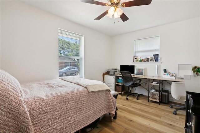 bedroom featuring light wood-type flooring and ceiling fan