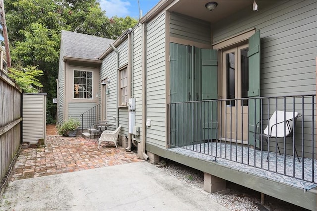 view of property exterior with a patio