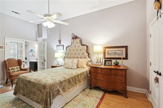 bedroom featuring high vaulted ceiling, ceiling fan, and light hardwood / wood-style flooring