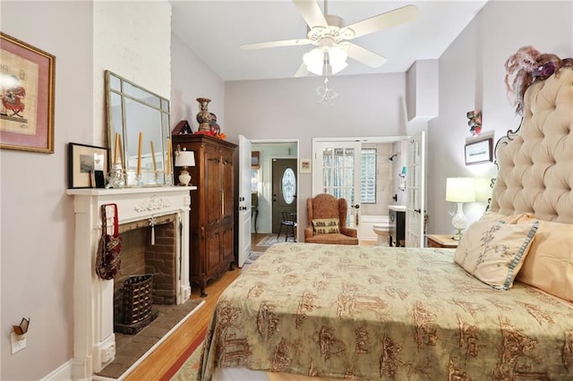 bedroom with light wood-type flooring, ensuite bath, and ceiling fan