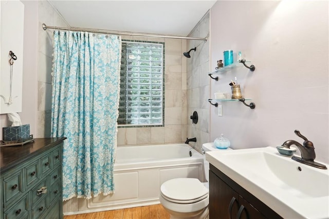 full bathroom featuring vanity, toilet, hardwood / wood-style flooring, and shower / bath combo