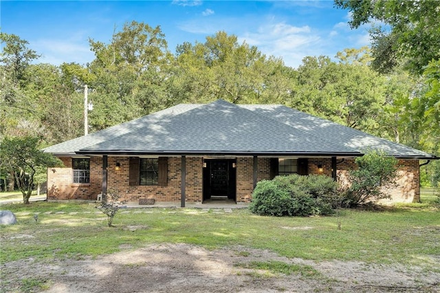 ranch-style house with a front lawn