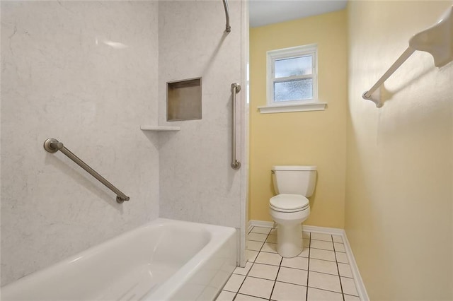 bathroom featuring baseboards, toilet, and tile patterned floors