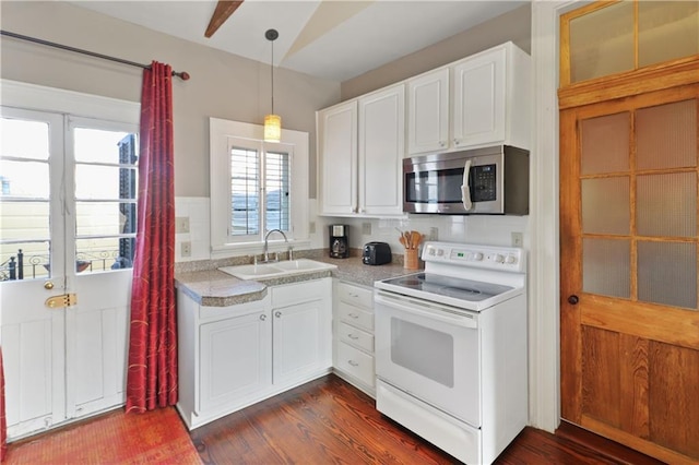 kitchen featuring dark hardwood / wood-style floors, pendant lighting, white cabinetry, sink, and electric range