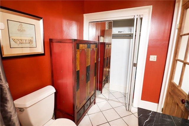 bathroom featuring tile patterned floors and toilet