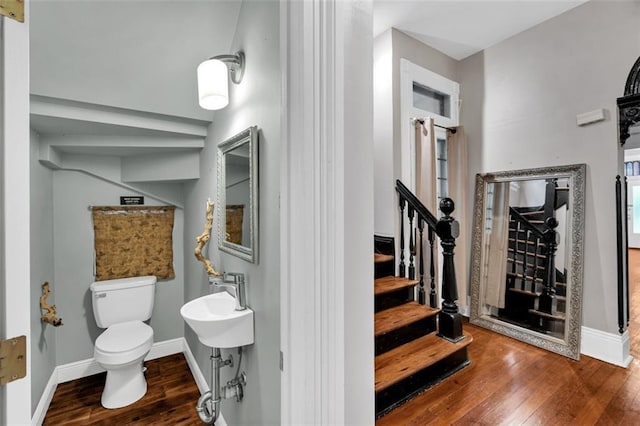 stairs with wood-type flooring and baseboards