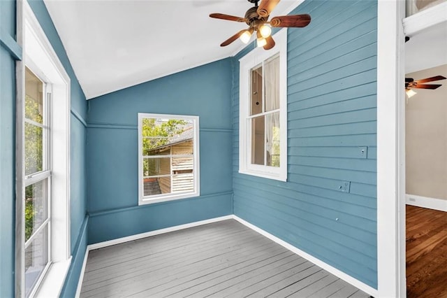 interior space with lofted ceiling and a ceiling fan