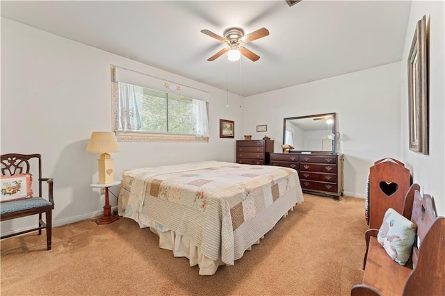 bedroom featuring ceiling fan and light colored carpet