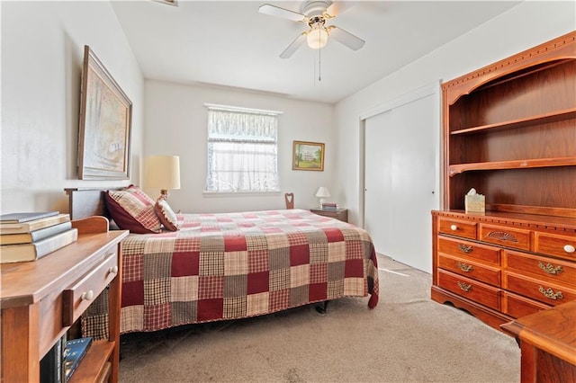 carpeted bedroom featuring ceiling fan