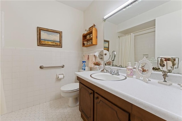 bathroom featuring vanity, a shower with curtain, tile patterned flooring, toilet, and tile walls