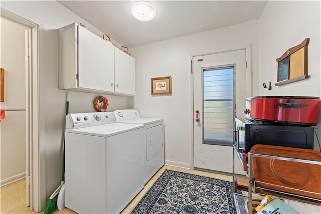 laundry area with cabinets and washer and dryer