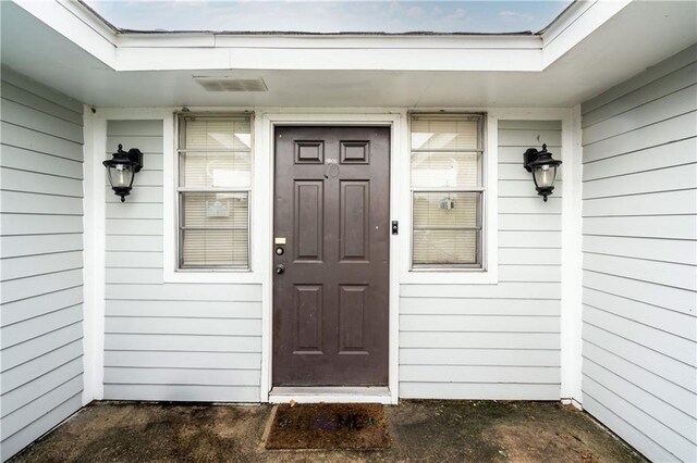 doorway to property with visible vents