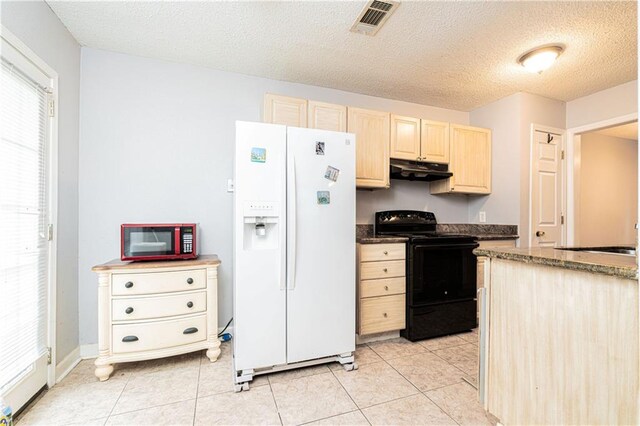 kitchen with light tile patterned floors, white refrigerator with ice dispenser, black range with electric stovetop, light brown cabinetry, and under cabinet range hood