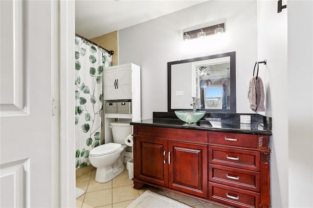 bathroom with tile patterned flooring, vanity, toilet, and a shower with shower curtain