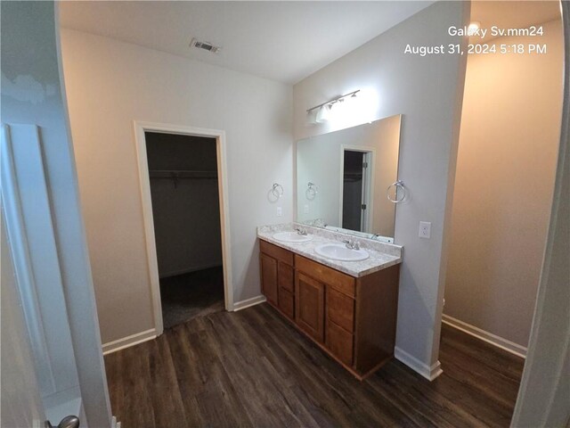 bathroom featuring vanity and hardwood / wood-style flooring