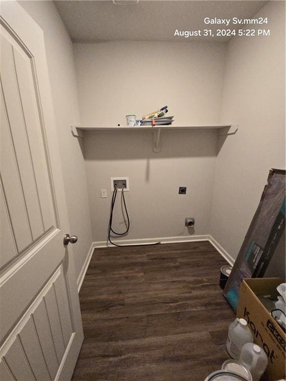 washroom featuring dark wood-type flooring, hookup for a washing machine, and electric dryer hookup