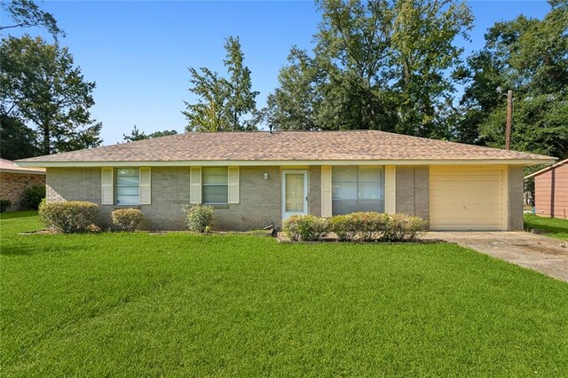 single story home with a front yard and a garage