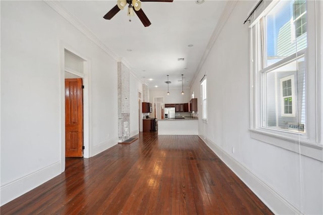 interior space featuring ornamental molding, ceiling fan, and dark hardwood / wood-style floors