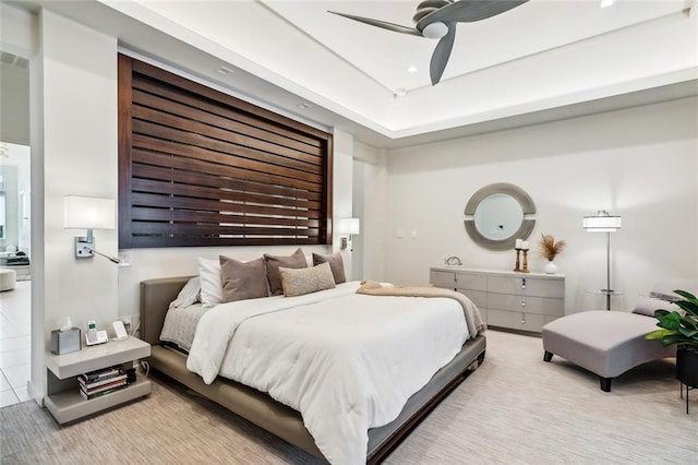 tiled bedroom featuring ceiling fan