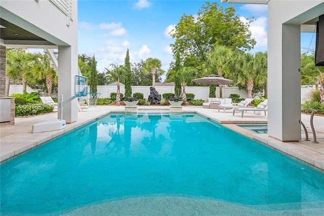 view of swimming pool with a patio