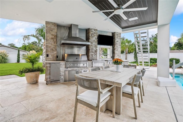 view of patio / terrace with area for grilling, ceiling fan, and a grill