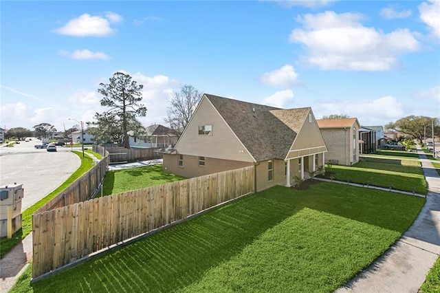 view of home's exterior with a yard