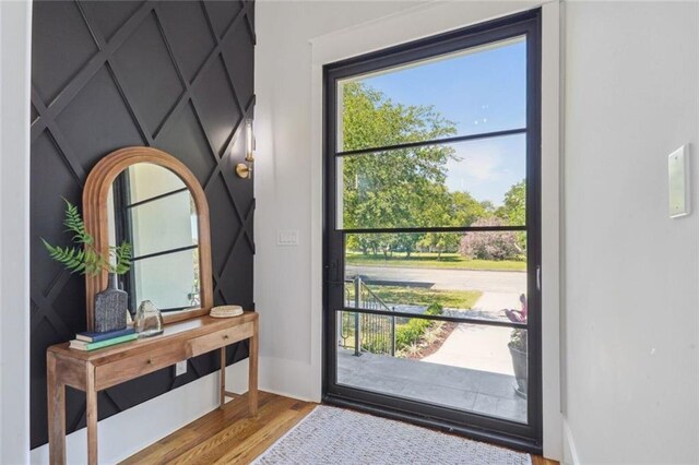 entryway with hardwood / wood-style flooring