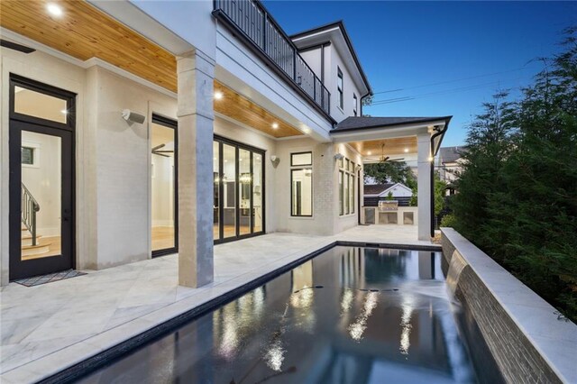 view of pool featuring a patio