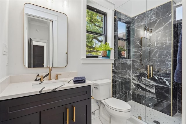 bathroom with an enclosed shower, toilet, and vanity