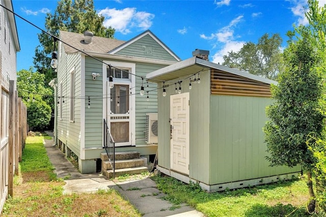 view of front of property with a storage unit