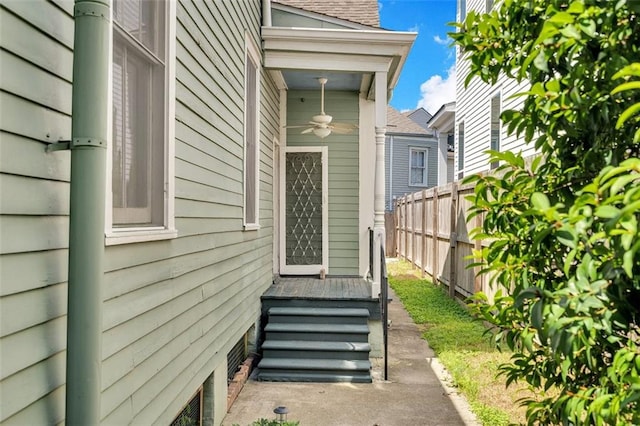 entrance to property featuring ceiling fan