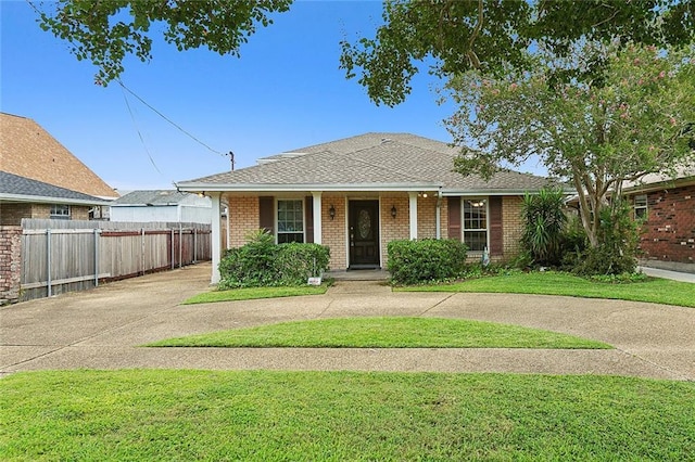 4508 Kawanee Ave, Metairie, LA 70006 - view of front of property featuring a front lawn, driveway, covered porch, fence, and brick siding