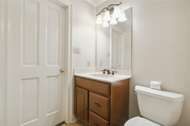 4508 Kawanee Ave, Metairie, LA 70006 - bathroom with toilet, ornamental molding, and vanity