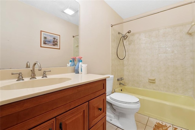 full bathroom featuring washtub / shower combination, tile patterned flooring, vanity, and toilet