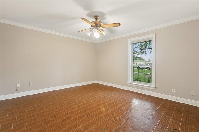 unfurnished room with crown molding, a healthy amount of sunlight, ceiling fan, and dark wood-type flooring