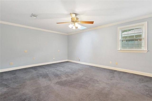 spare room featuring visible vents, baseboards, ceiling fan, crown molding, and carpet flooring