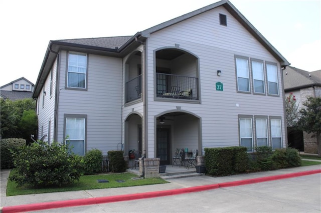 view of front of home with a balcony