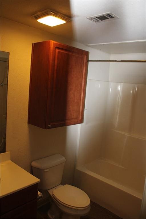 full bathroom featuring toilet, bathing tub / shower combination, and vanity