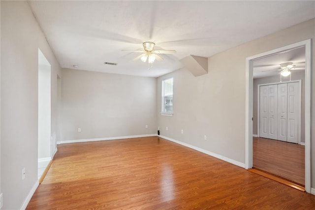 unfurnished room with light hardwood / wood-style flooring and ceiling fan