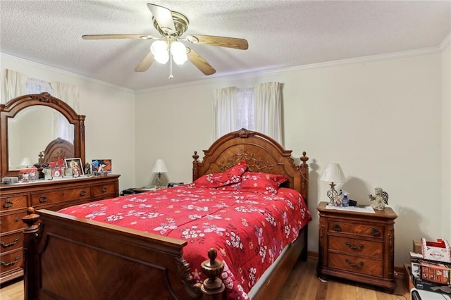 bedroom with light wood-type flooring, crown molding, ceiling fan, and a textured ceiling